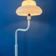 Mid-century mushroom floor lamp with a white plexiglass shade.