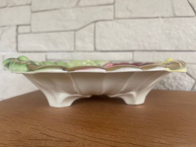 Old fruit bowl in tricolor Barbotine. Grape decor.