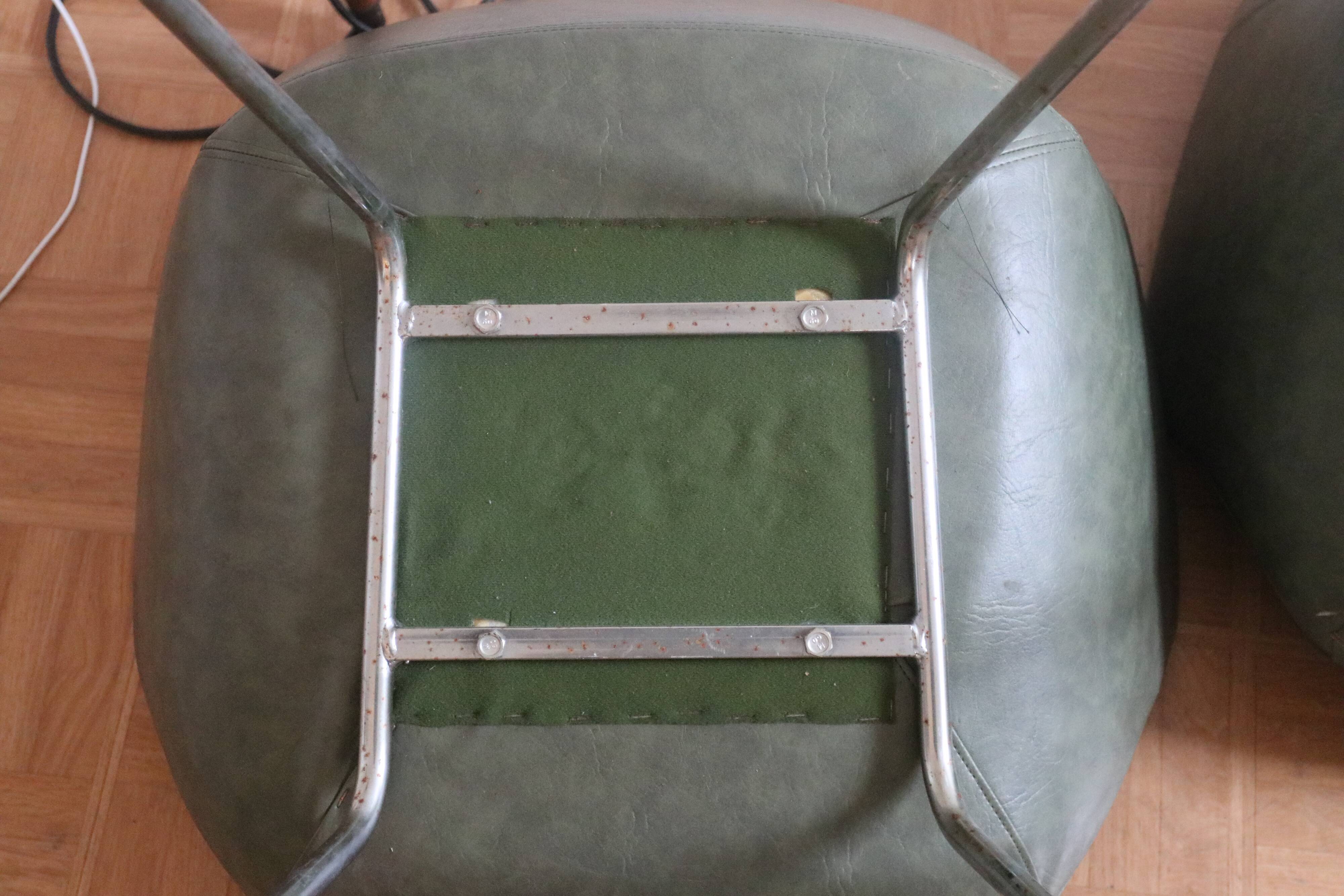Lot of three armchair in green skai with chrome feet