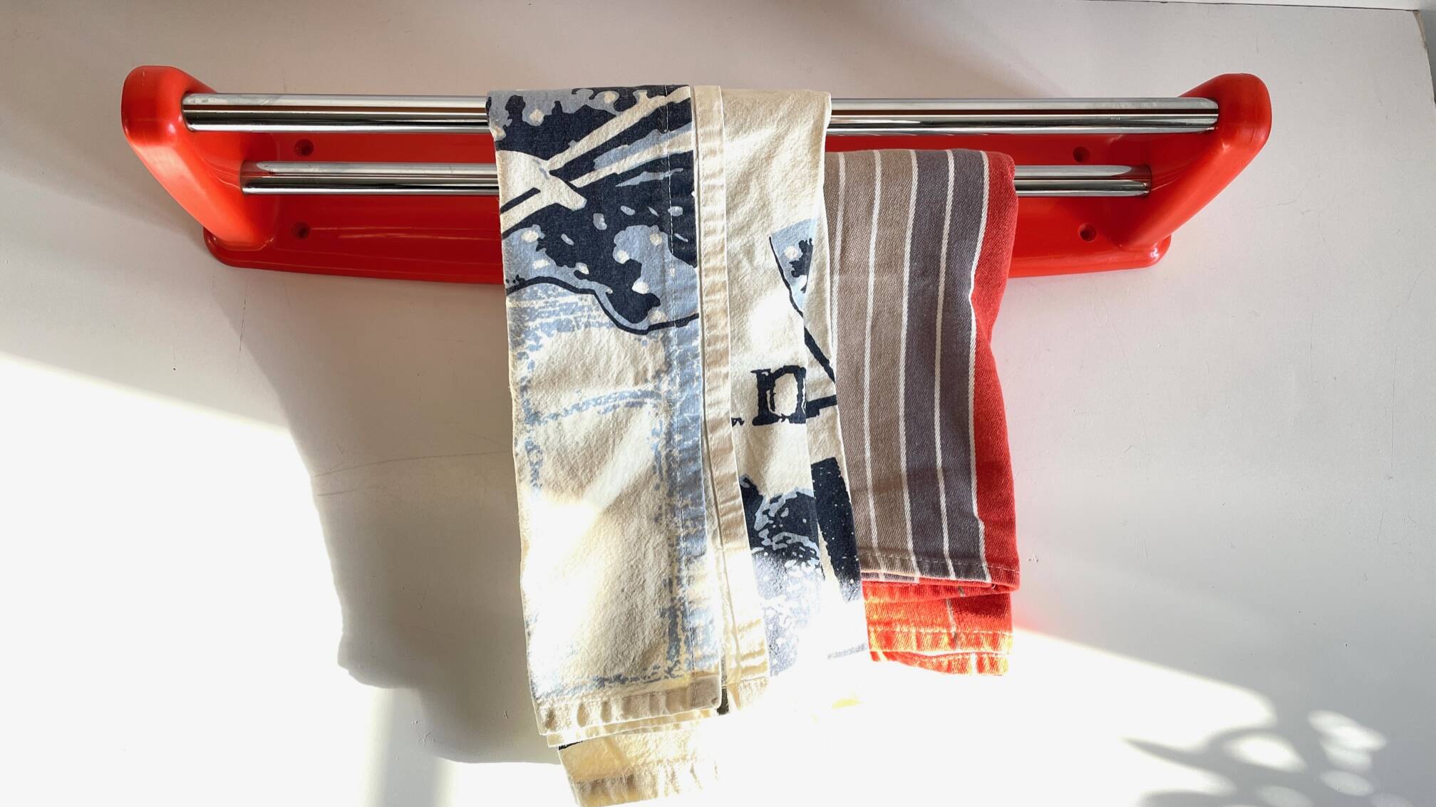 Orange towel rack by Syla from the 70s