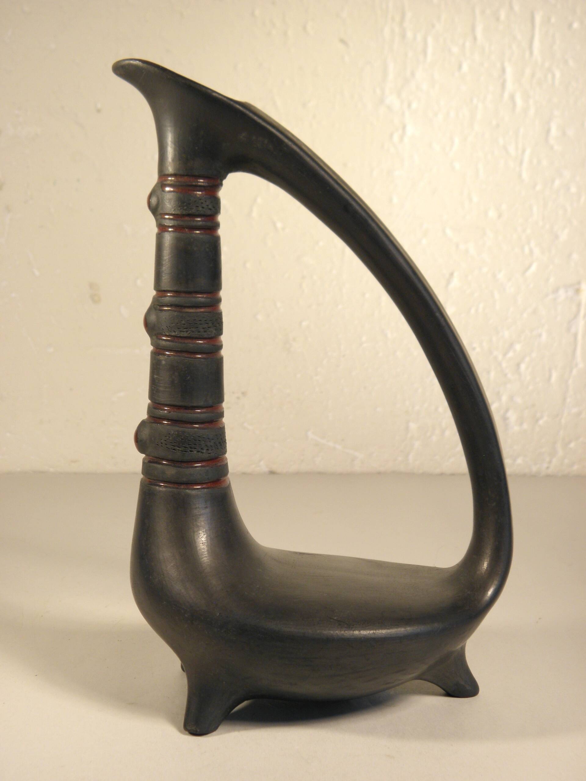 Zoomorphic pitcher vase in black ceramic