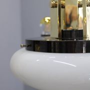 1930s Czech Art Deco brass chandelier with milk glass center and exposed bulbs