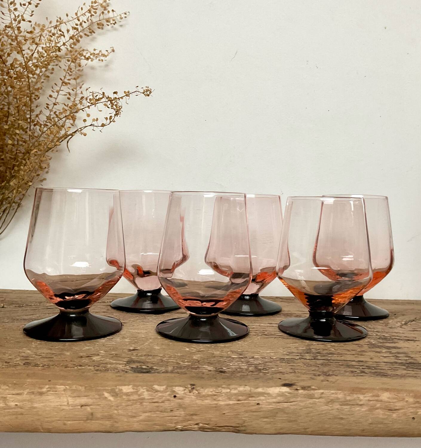 6 small pink glasses with black stem
