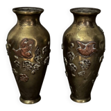 Pair of Japanese vases in chiselled bronze with inlaid bird decoration.
