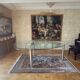 Table ghibli en verre avec 8 chaises parisiennes pieds sabrés roche bobois