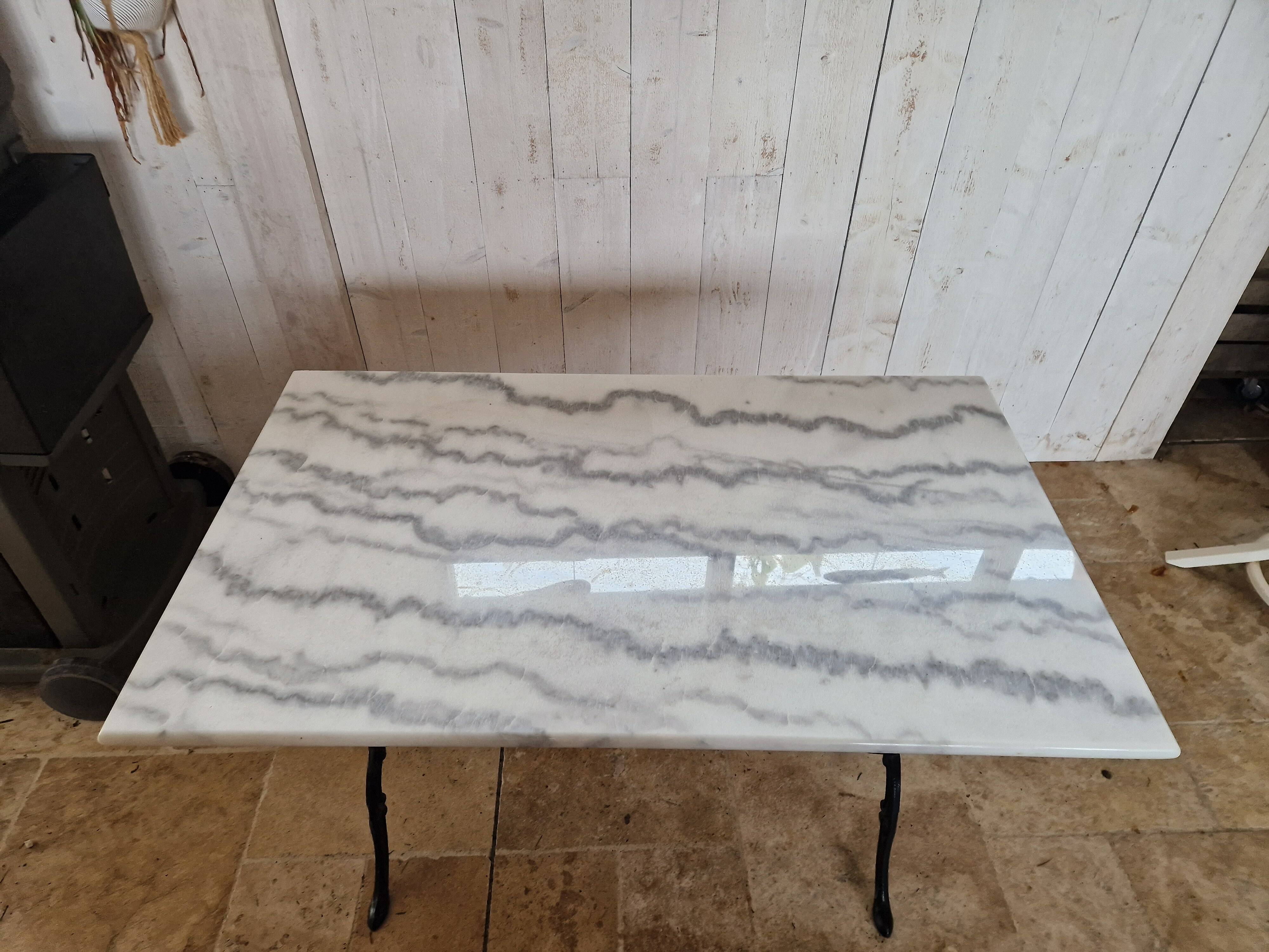 Bistro table with marble top and cast iron legs