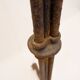 Wrought iron tripod floor lamp decorated with stylized animal heads
