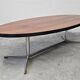 Danish Mid Century Modern oval coffee table with a teak top and chrome legs.