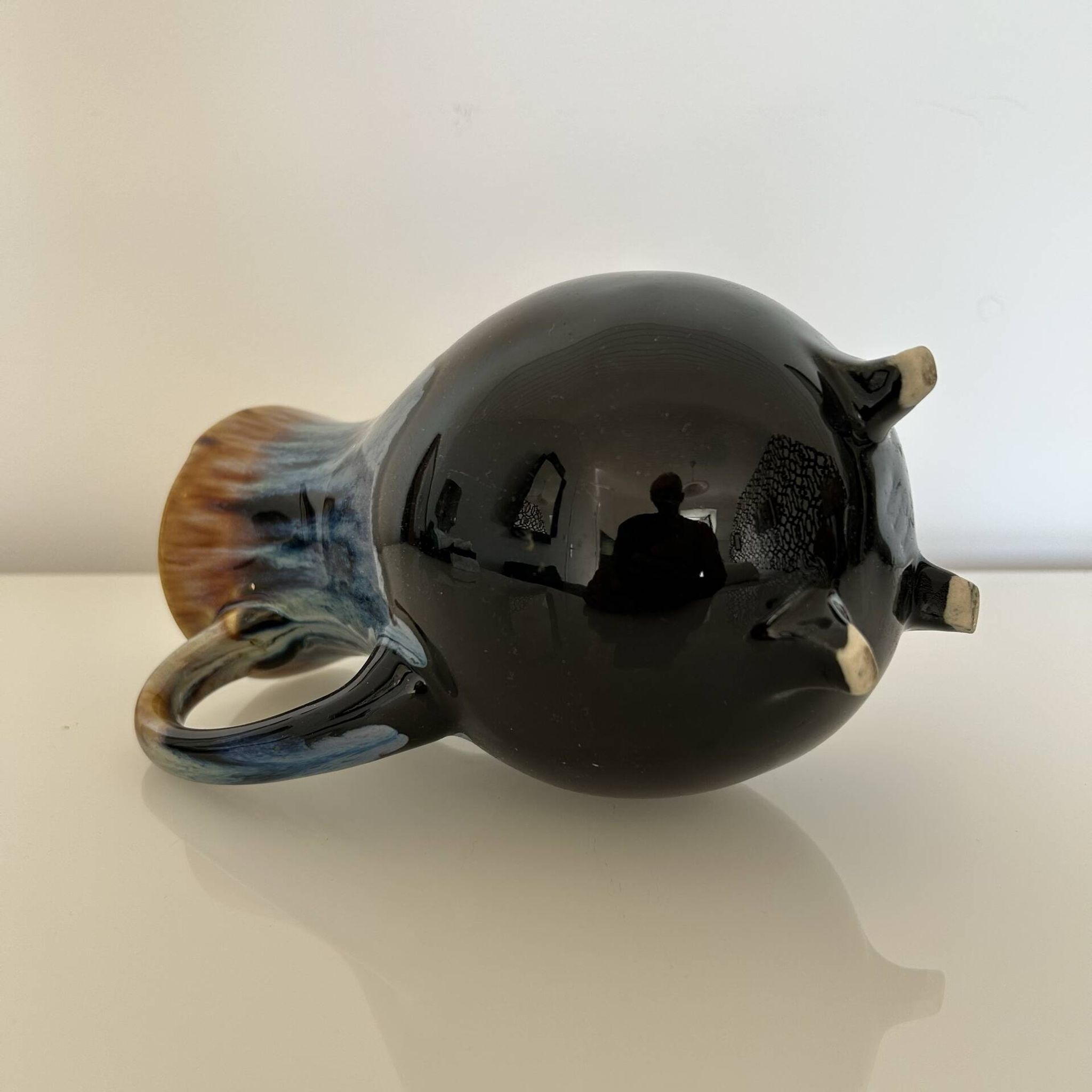 Flamed blue tripod jug