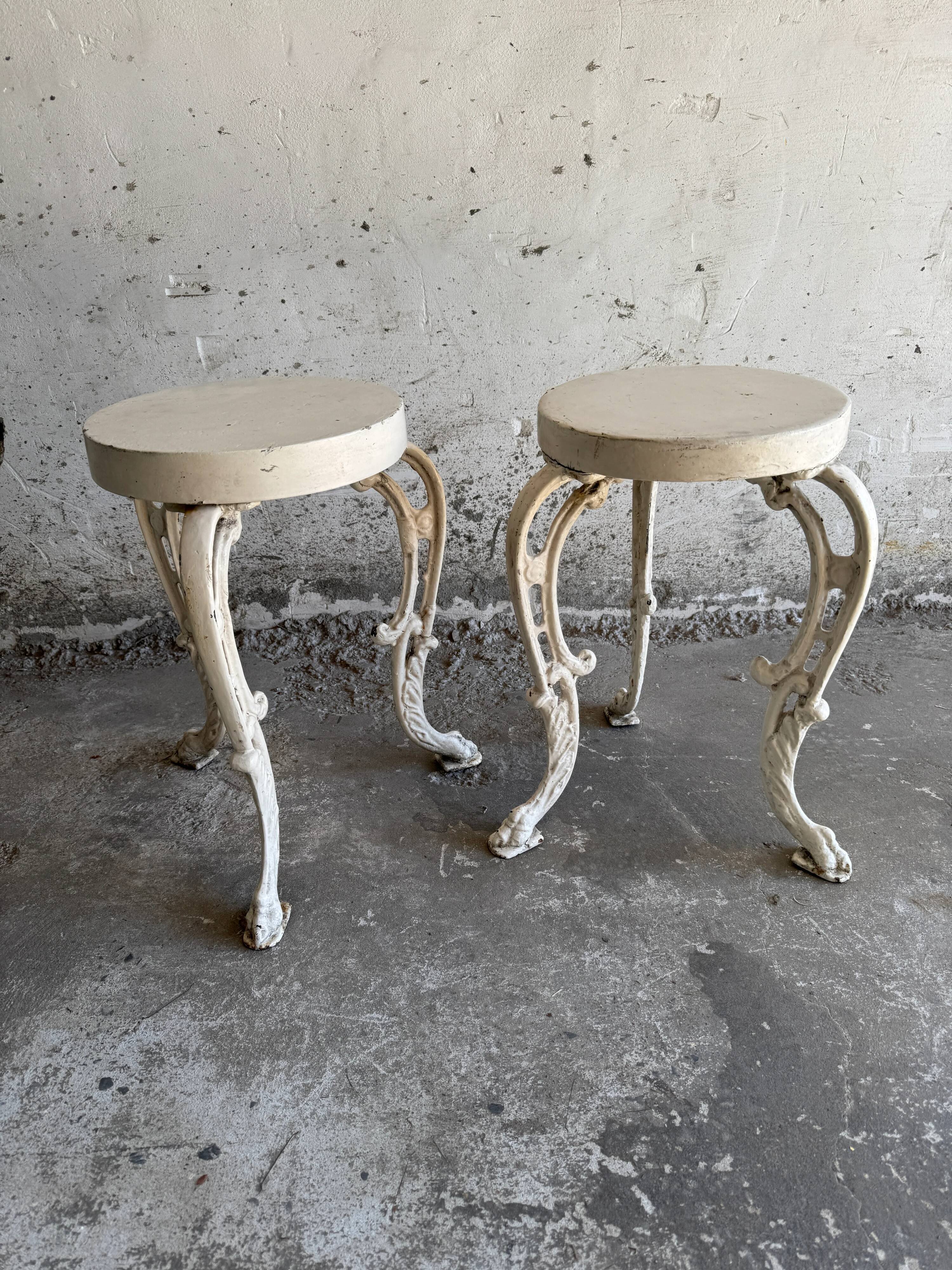 Pair of cream-white cast iron side tables with wooden tops — neoclassical shabby-chic