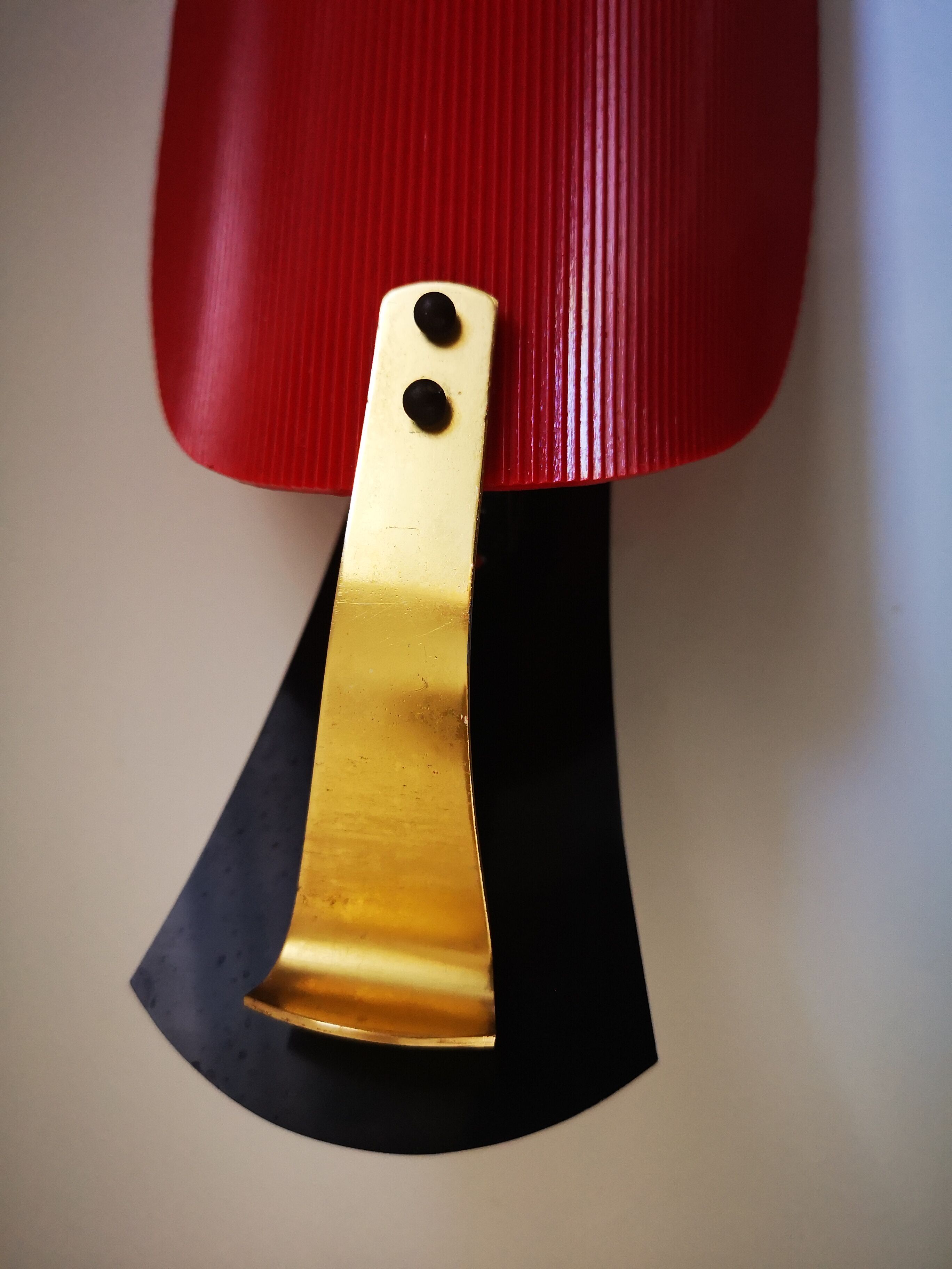 Red and black vintage sconce in fluted plastic and brass
