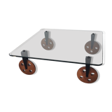 Glass coffee table on teak wheels