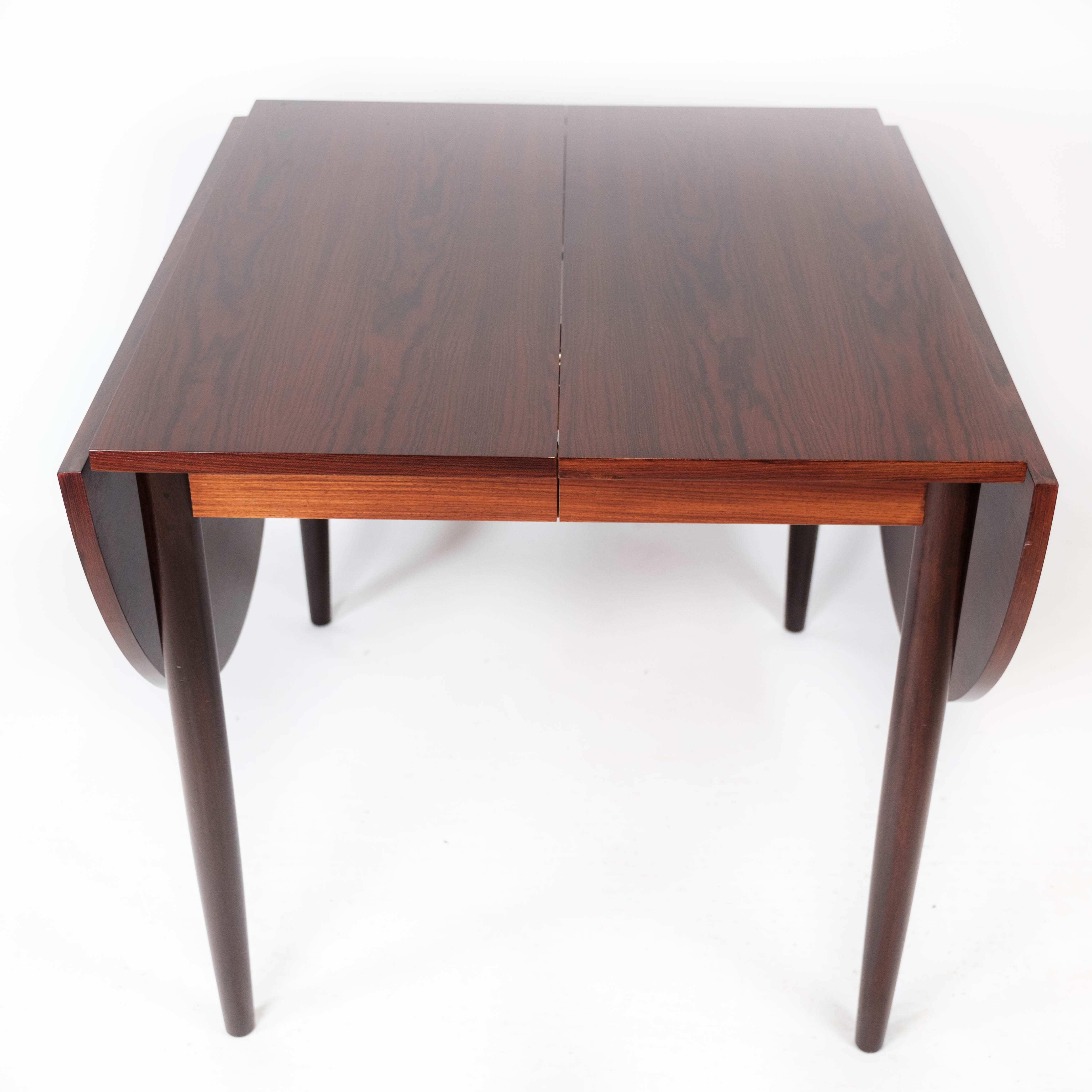 Dining table in rosewood with extension plates, designed by Arne Vodder, 1960s