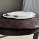 Antique oval-shaped white crackled faience plate with a scalloped edge.
