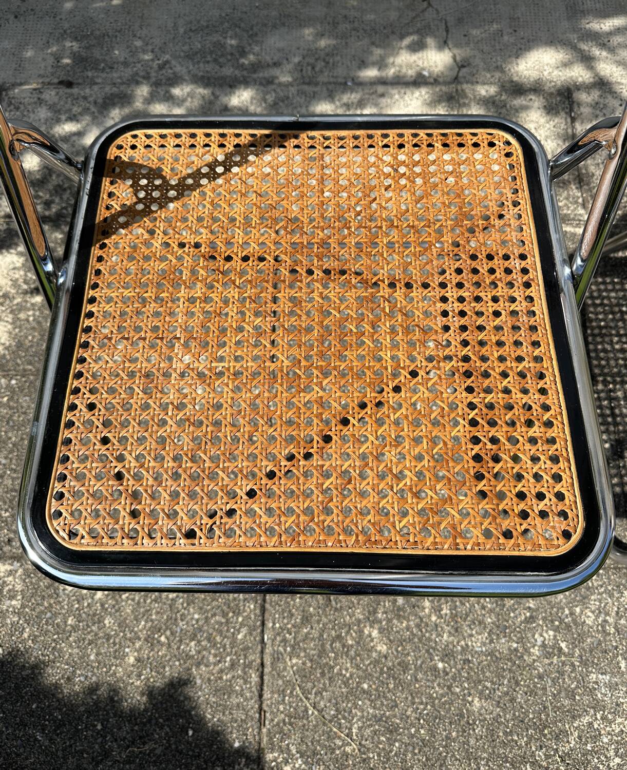 Pair of vintage metal caned folding chairs