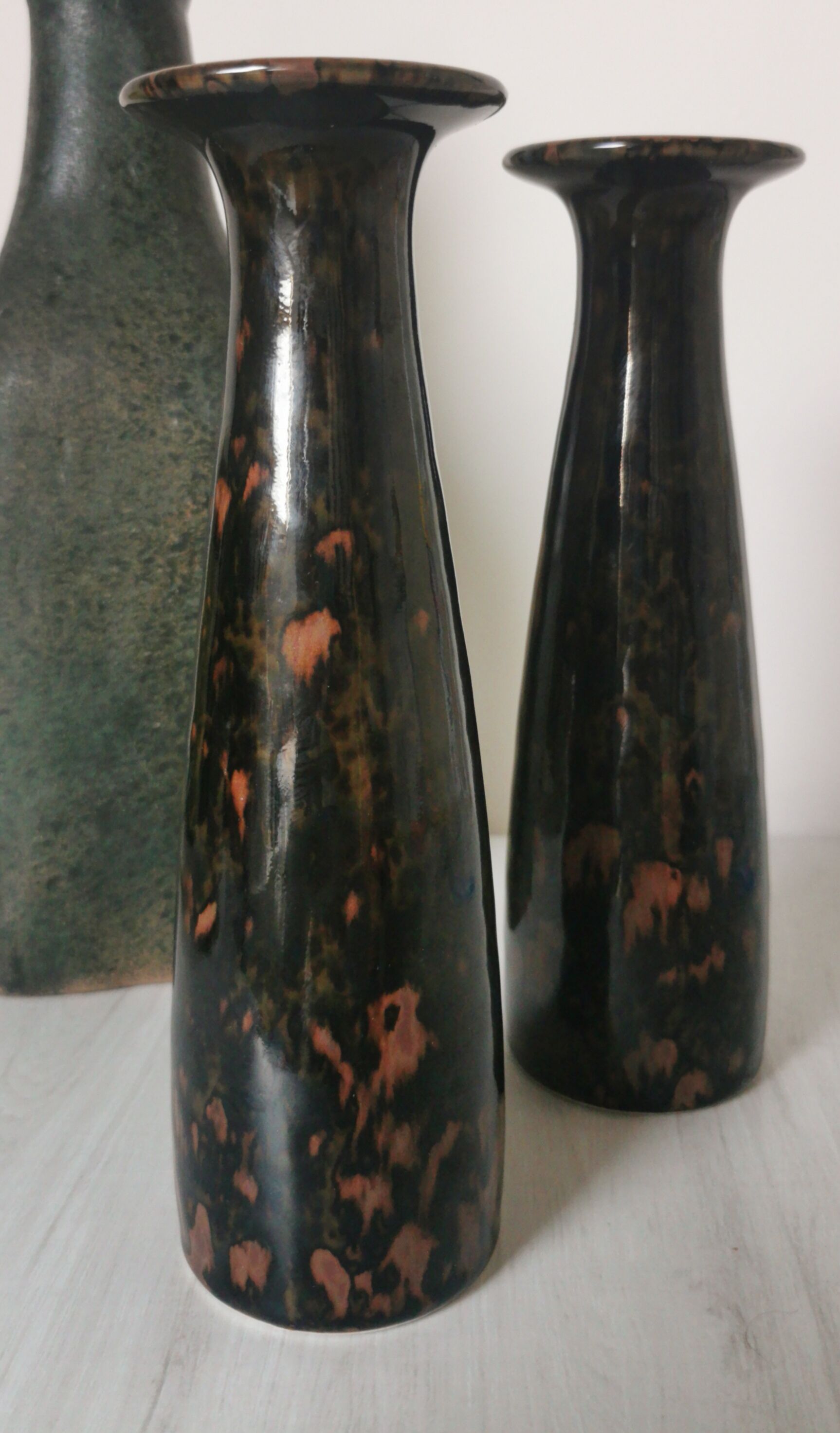 Pair of enamelled ceramic candlesticks