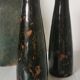 Pair of enamelled ceramic candlesticks