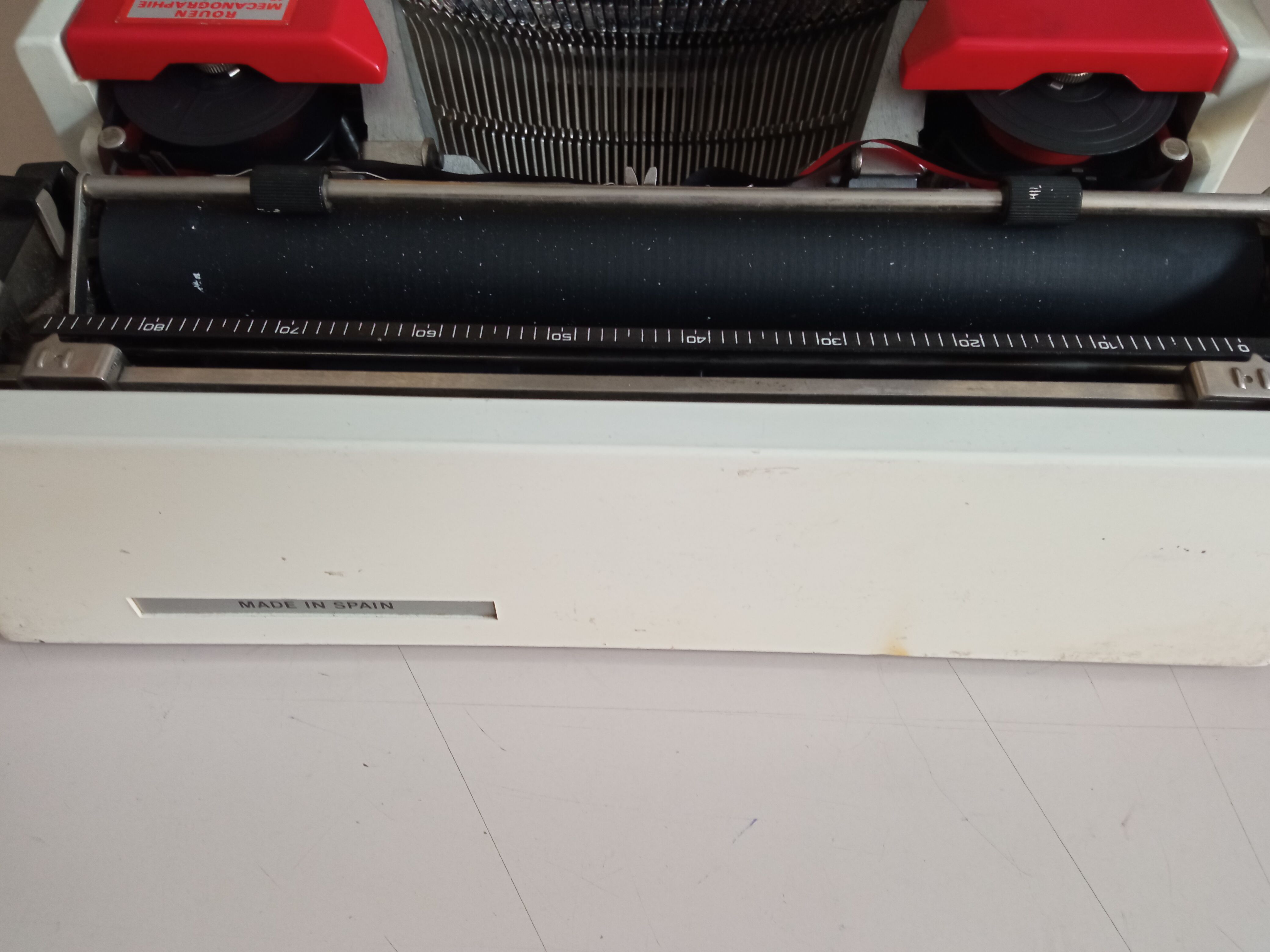 Typewriter "Burelec 315" made in Spain in red and white metal.