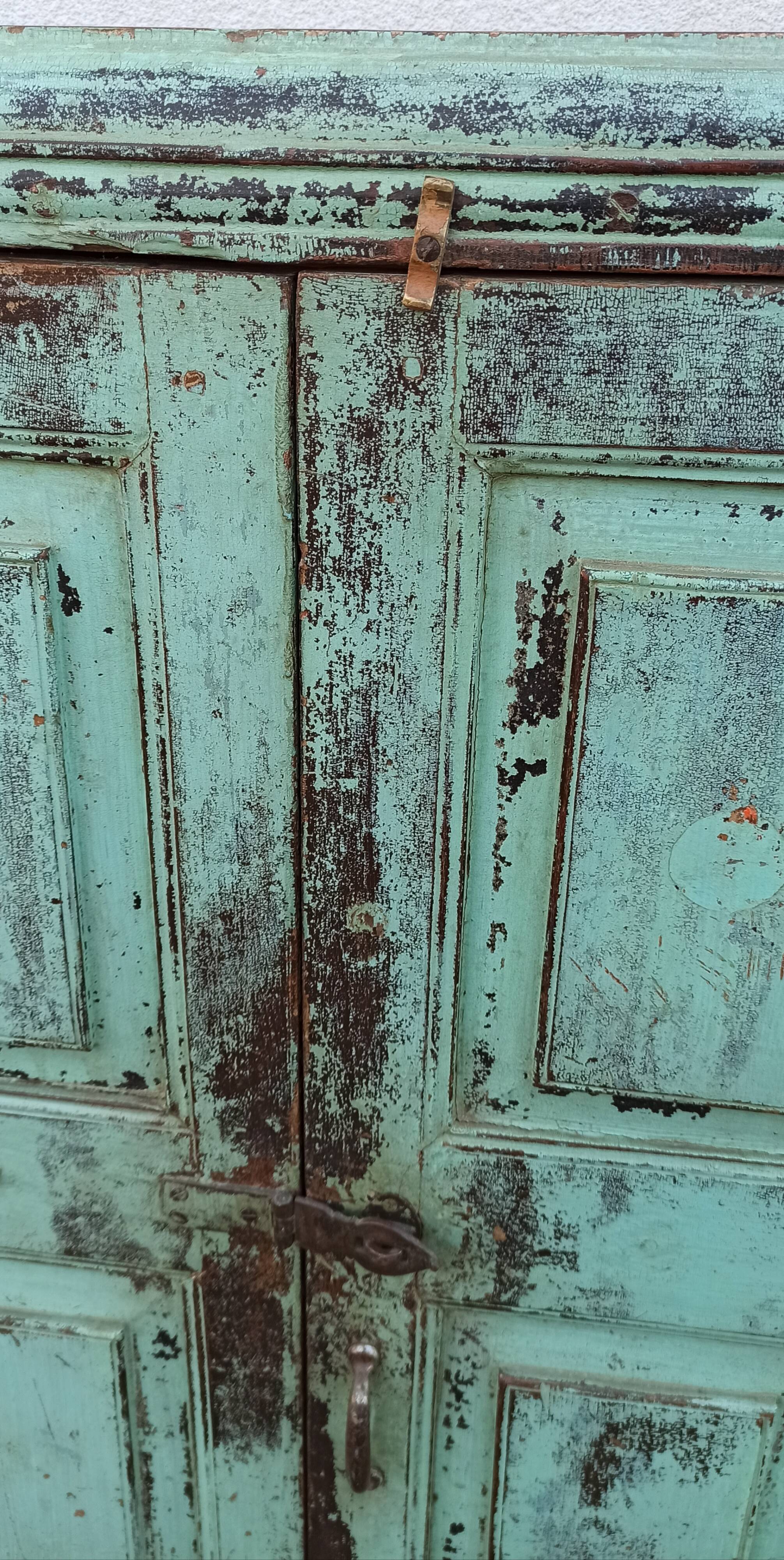 Old wooden cabinet with beautiful green patina