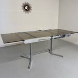 Smoked glass dining table with chrome legs, 1970s design by Roche Bobois.