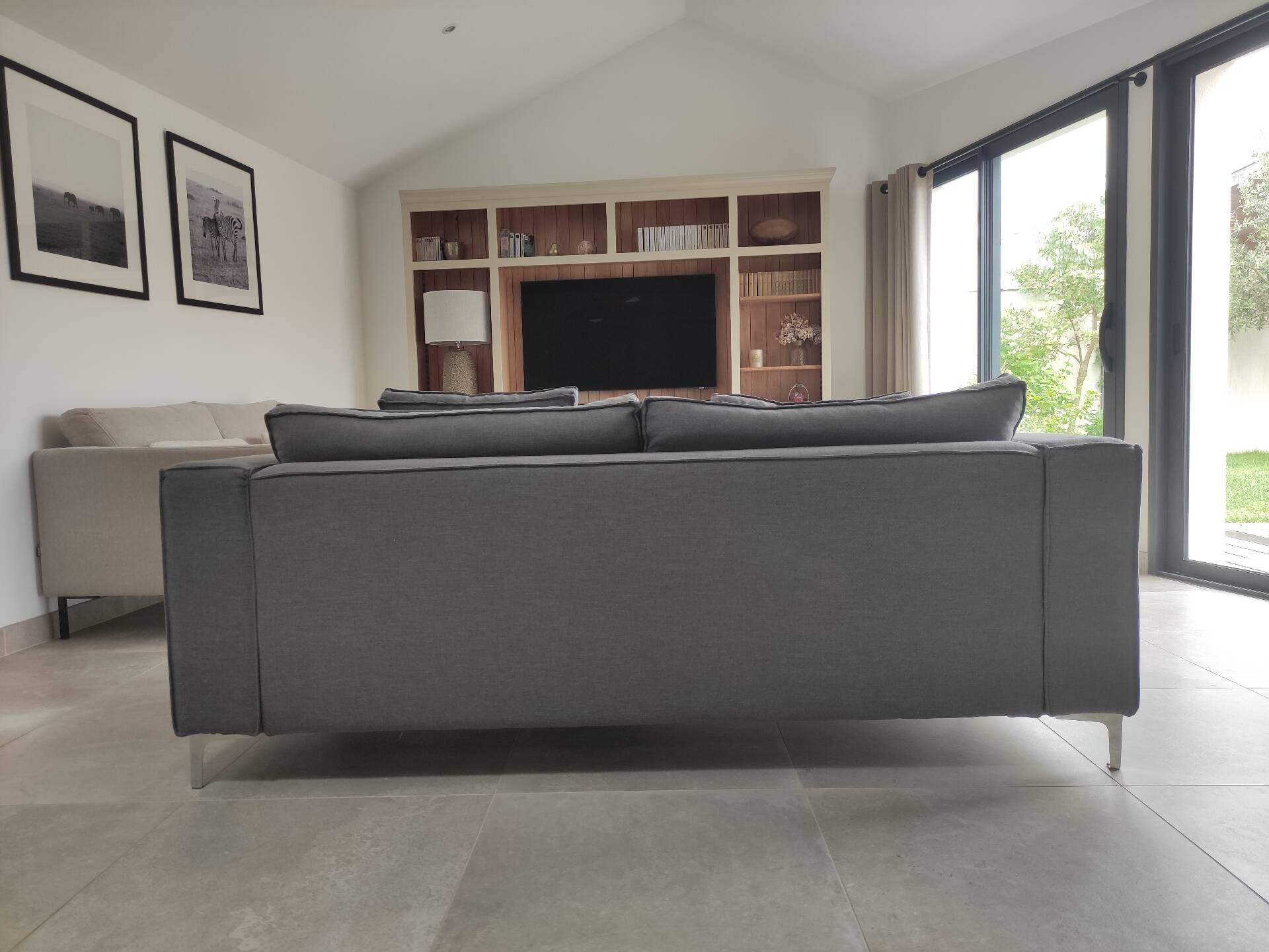 Three-seater grey mottled fabric sofa