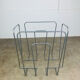 Postmodern magazine rack in grey metal, 1980s.
