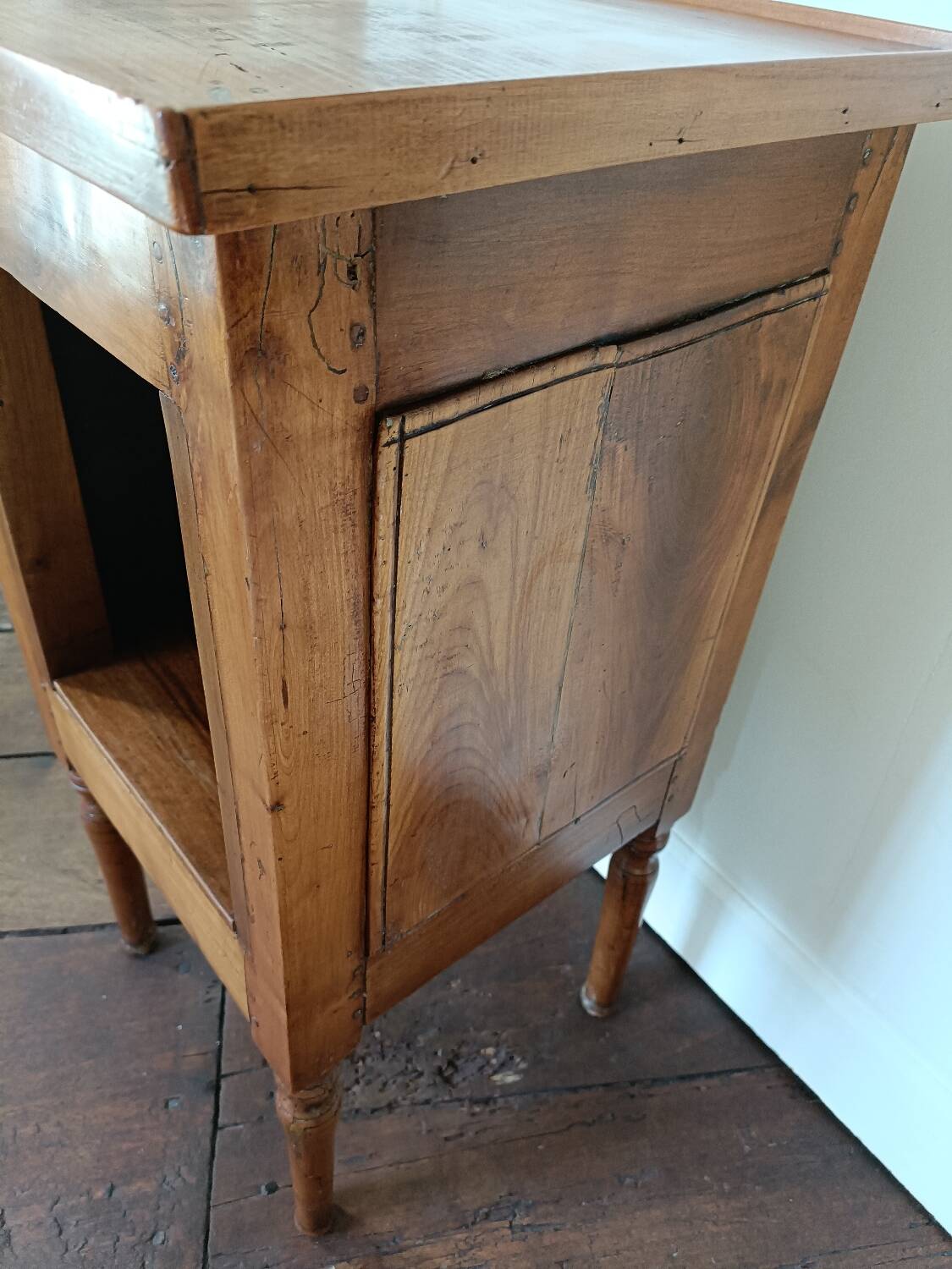 Open wooden bedside table