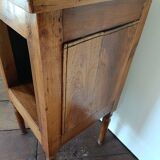 Open wooden bedside table