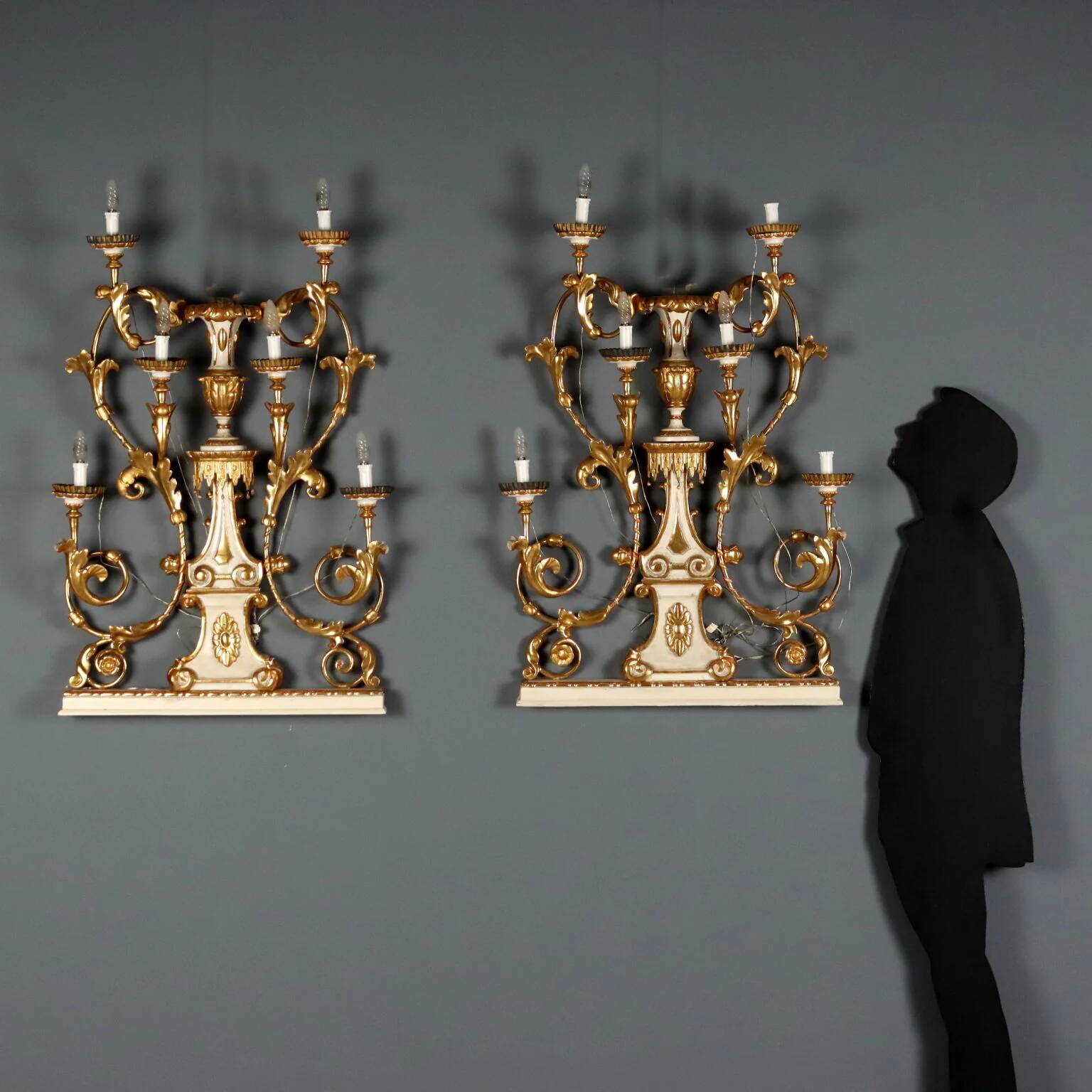 Antique wall sconces in wood and iron, Italy, mid-19th century.