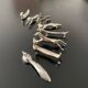 8 various animal knife holders in silver-colored metal