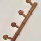 Wall-mounted coat rack in bamboo effect wood