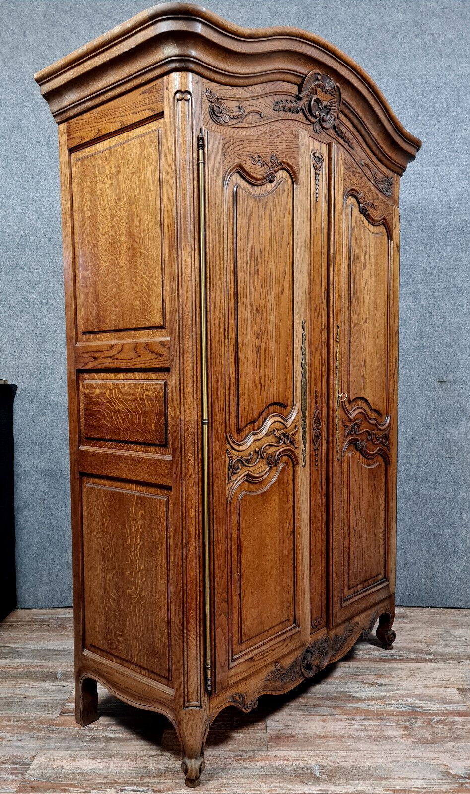 Louis XV style wardrobe with gendarme's hat in solid oak