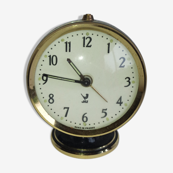 Jaz clock of black round mechanical travel, 60s/70s
