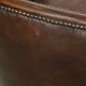 Set of 2 club chairs/armchairs in dark cognac leather