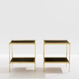 Pair of neoclassical side tables in brass and black leather by Maison Jansen, 1960.