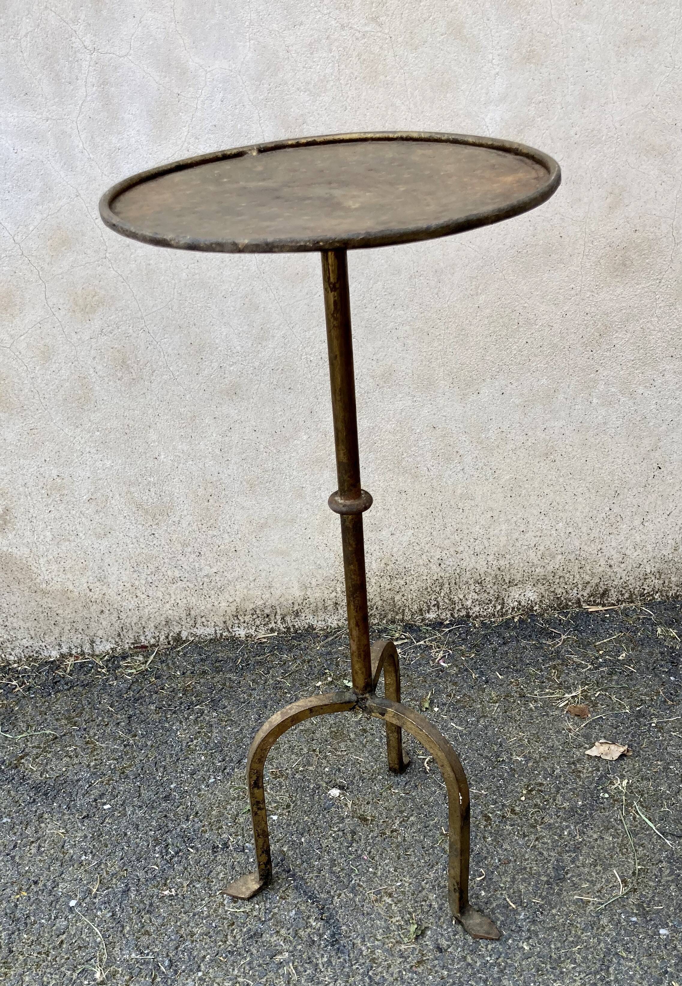 Henri POUENAT (1934-1987) Steel table or pedestal table with a golden patina