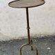 Henri POUENAT (1934-1987) Steel table or pedestal table with a golden patina