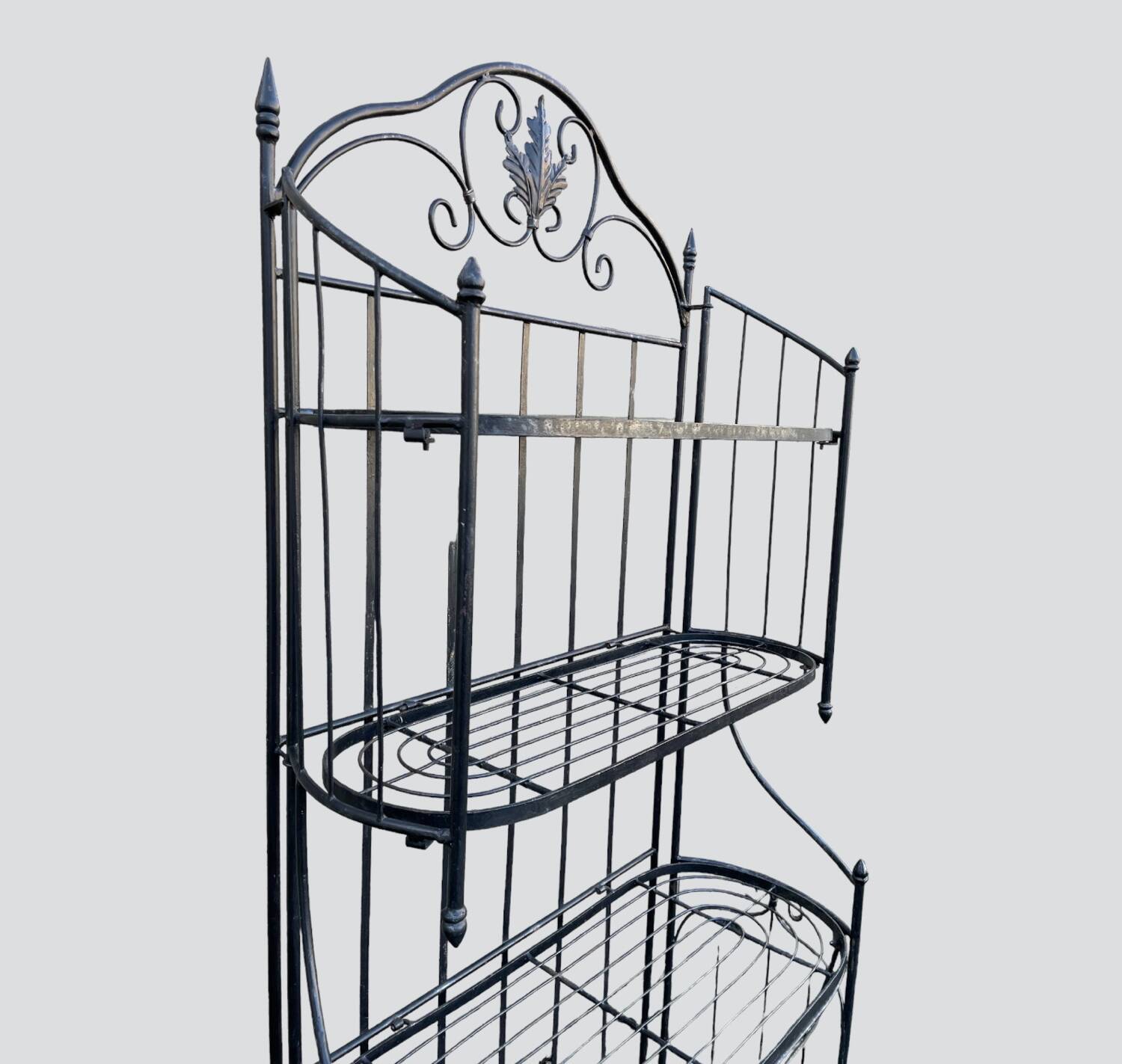 Old wrought iron garden shelf for plants