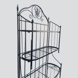 Old wrought iron garden shelf for plants
