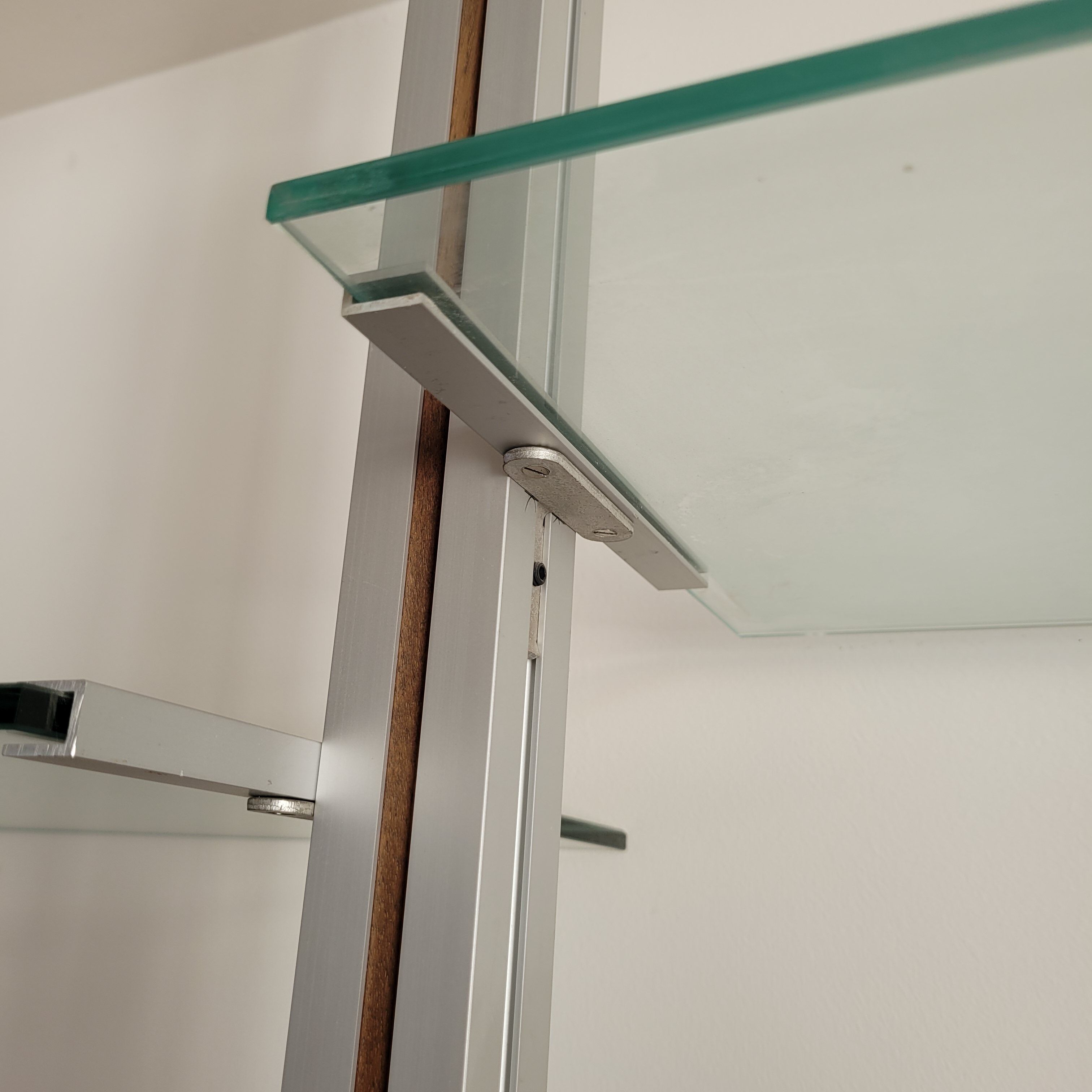 Large Scandinavian wall-mounted wood and aluminum bookcase circa 1960