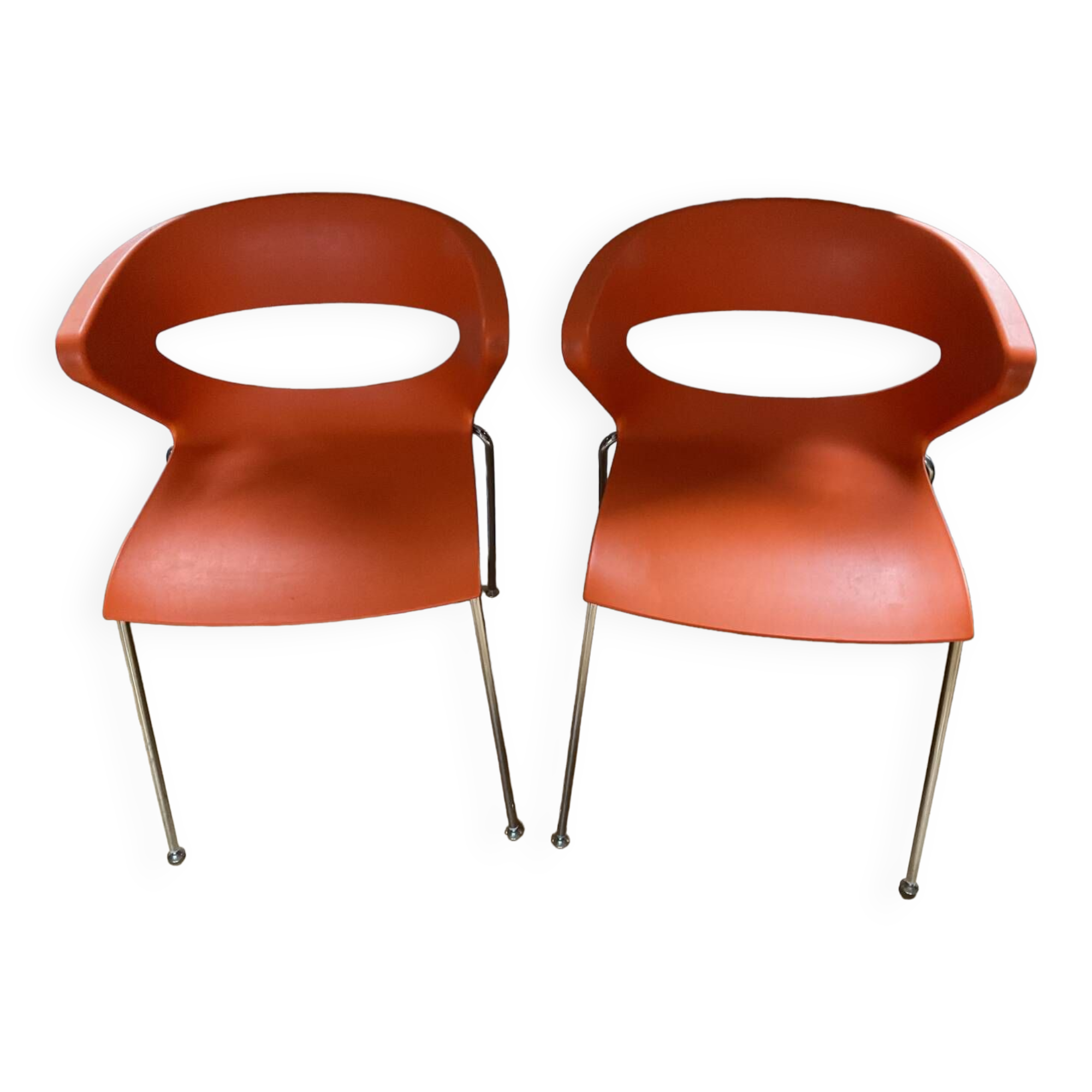Two orange kicca chairs made in italy tbe