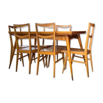 Table with extensions and vintage chairs