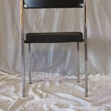 Modernist chair in chromed metal and black imitation leather