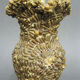 Vase covered with shells. Seaside souvenir.