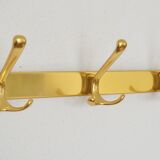 Brass wall-mounted coat rack in Bauhaus style from the 1950s