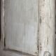 A pair of distressed bedside tables.