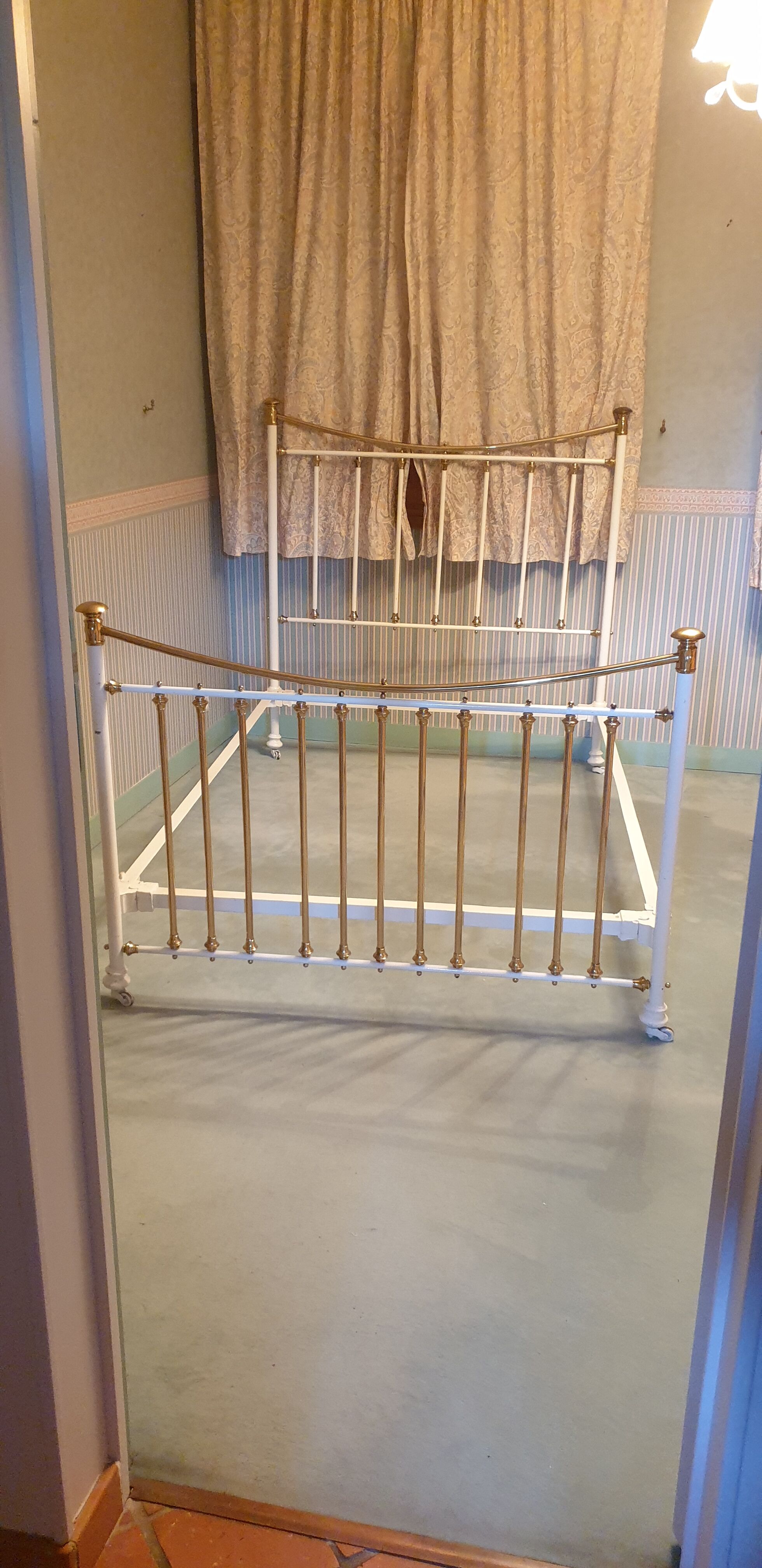 Restored old iron bed