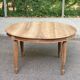 Art Deco round extendable dining table stripped in solid walnut from the 1920s.