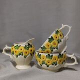 Sunflower flower cups and milk jug