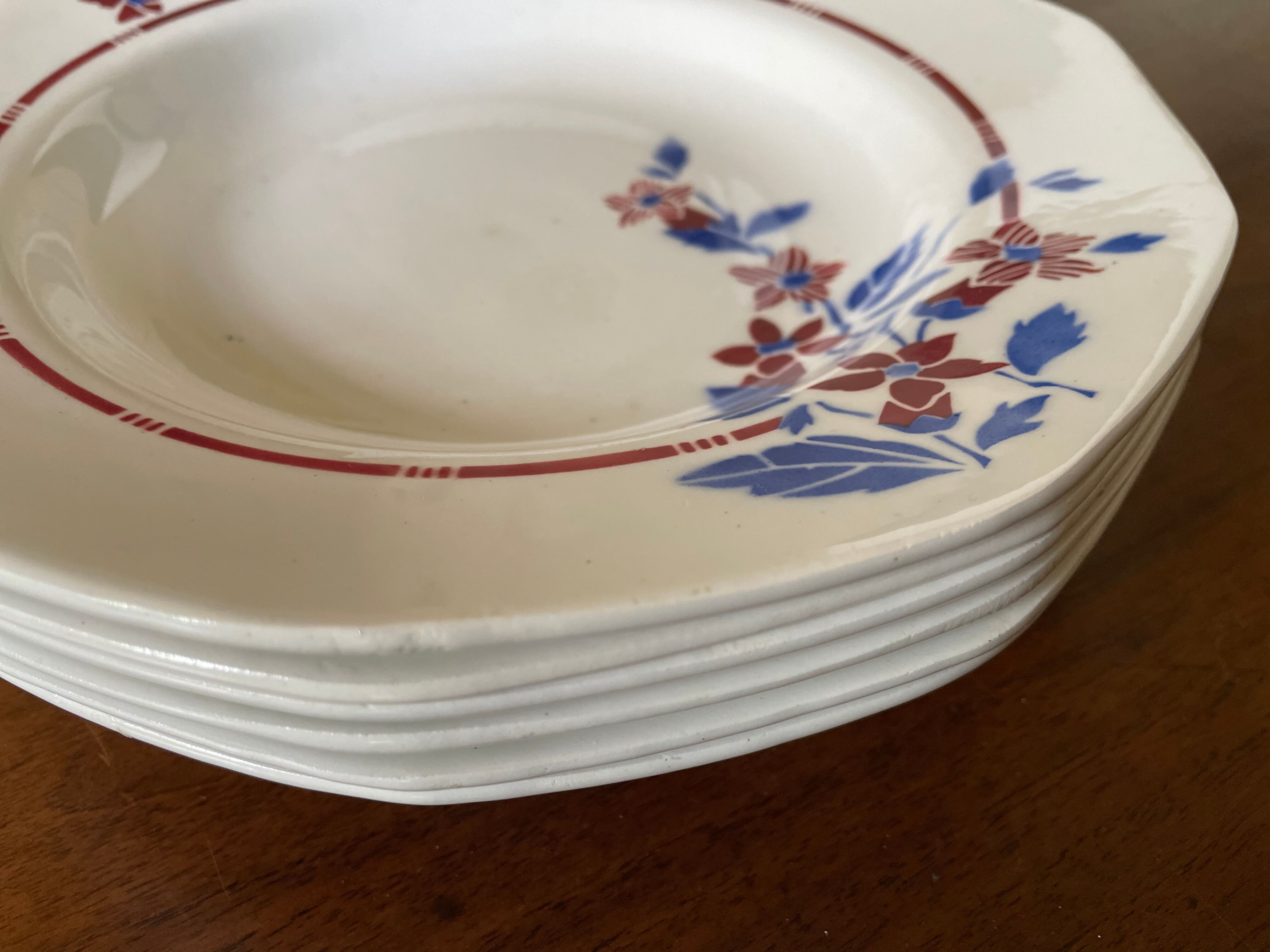 Saint Amand hollow plates decorated with red and blue flowers